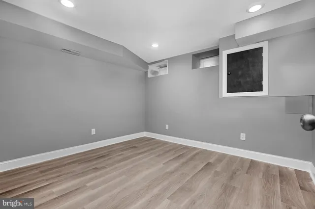 a white toilet sitting next to a bathroom sink