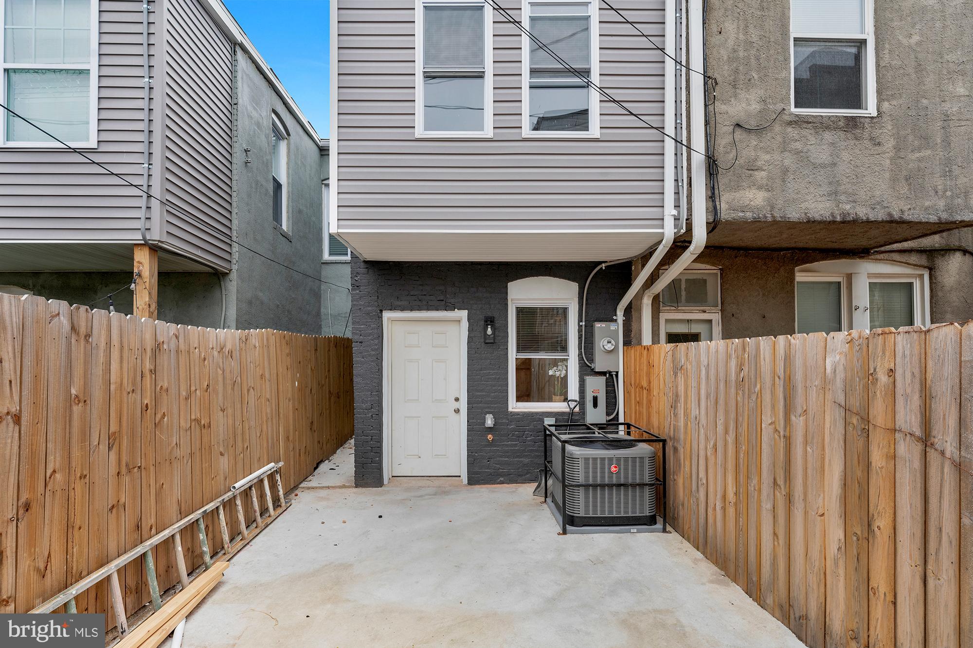 1908 East Lanvale Street Baltimore, MD 21213 - Photo 45 of 49 a backyard of a house with deck and furniture