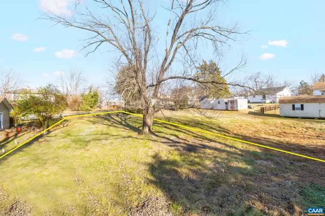 a view of yard with swimming pool