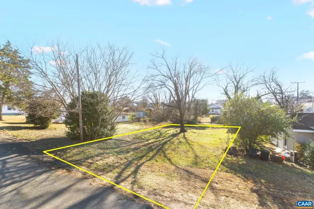 a view of a backyard with swimming pool