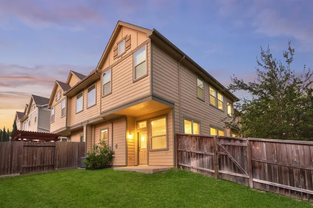 a view of a house with a yard and plants