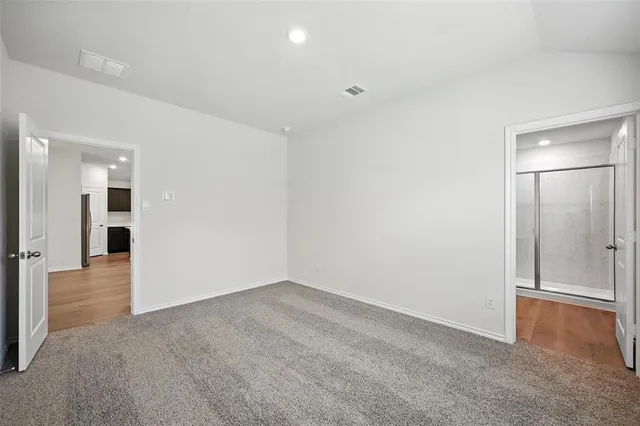 a kitchen with stainless steel appliances granite countertop a sink stove refrigerator and cabinets