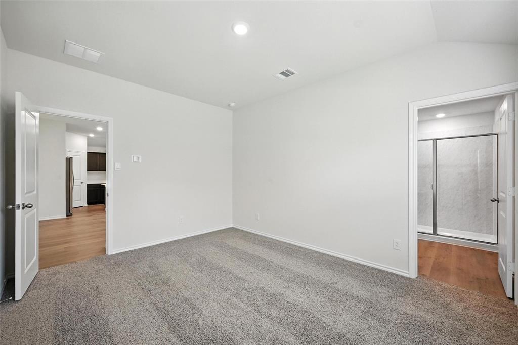 405 Regiment Road Sherman, TX 75090 - Photo 9 of 22 an empty room with wooden floor and windows