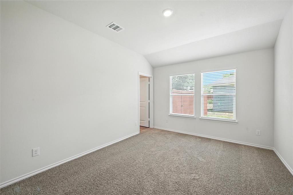 405 Regiment Road Sherman, TX 75090 - Photo 10 of 22 a view of an empty room with a window