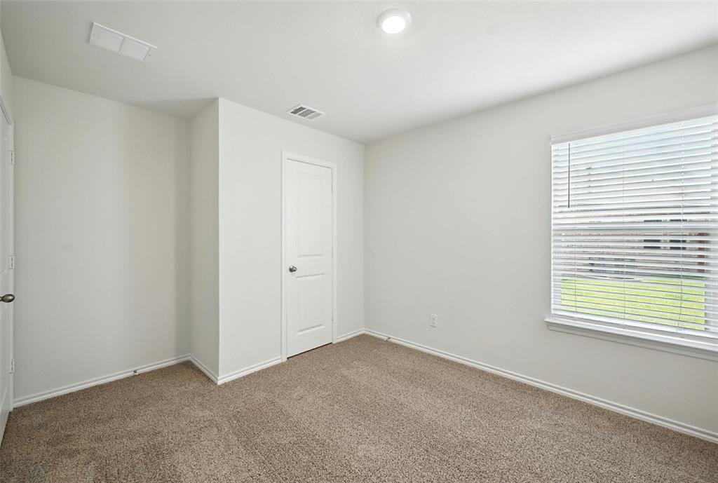 405 Regiment Road Sherman, TX 75090 - Photo 11 of 22 an empty room with windows