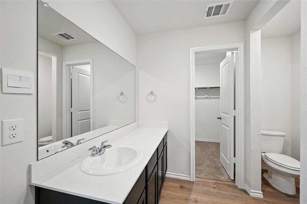 405 Regiment Road Sherman, TX 75090 - Photo 13 of 22 a bathroom with a sink toilet and shower