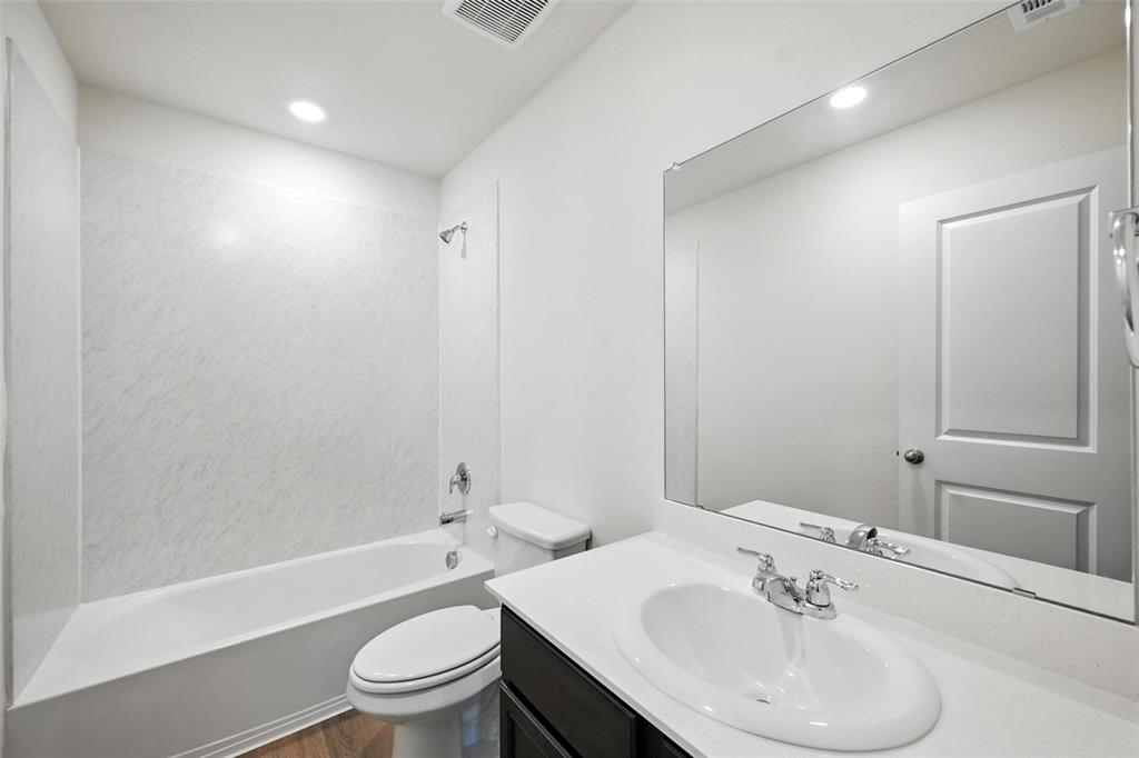 405 Regiment Road Sherman, TX 75090 - Photo 15 of 22 a bathroom with a sink toilet and shower