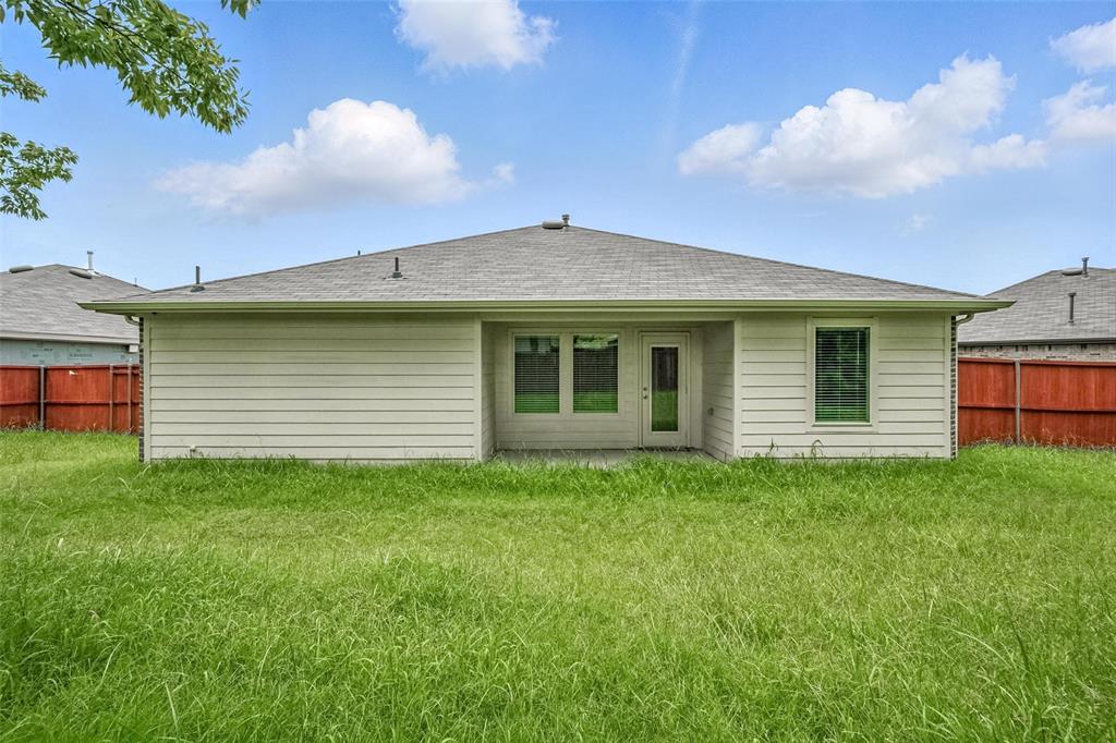 405 Regiment Road Sherman, TX 75090 - Photo 17 of 22 a front view of a house with a garden