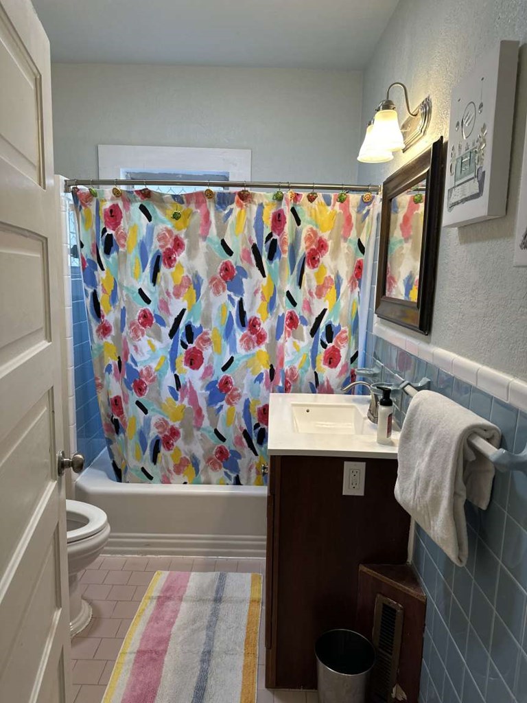 443 2nd Avenue Columbus, GA 31901 - Photo 9 of 20 a bathroom with a sink mirror vanity and toilet