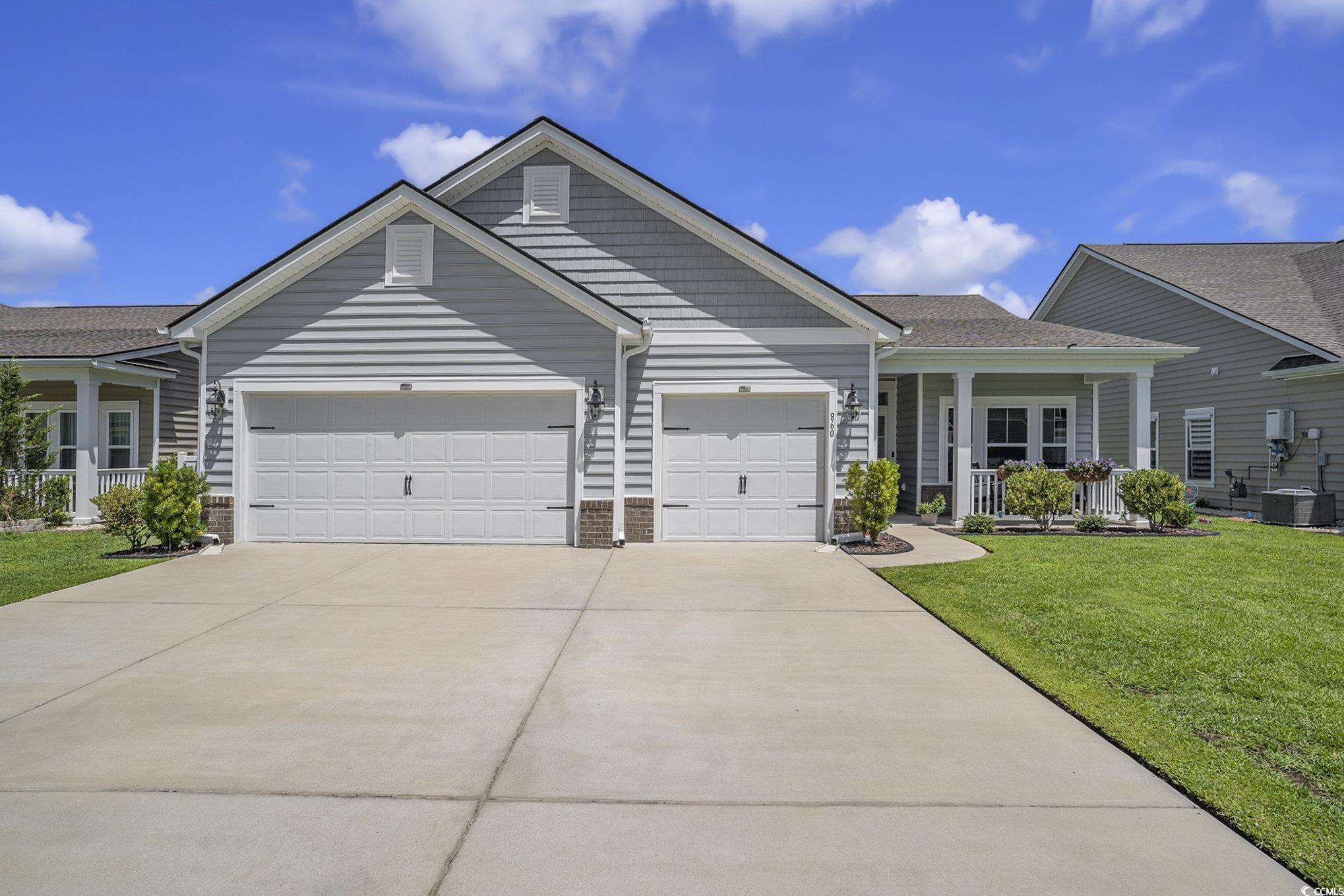 860 Brant Street Myrtle Beach, SC 29579 - Photo 1 of 40 Ranch-style house featuring covered porch, a garag