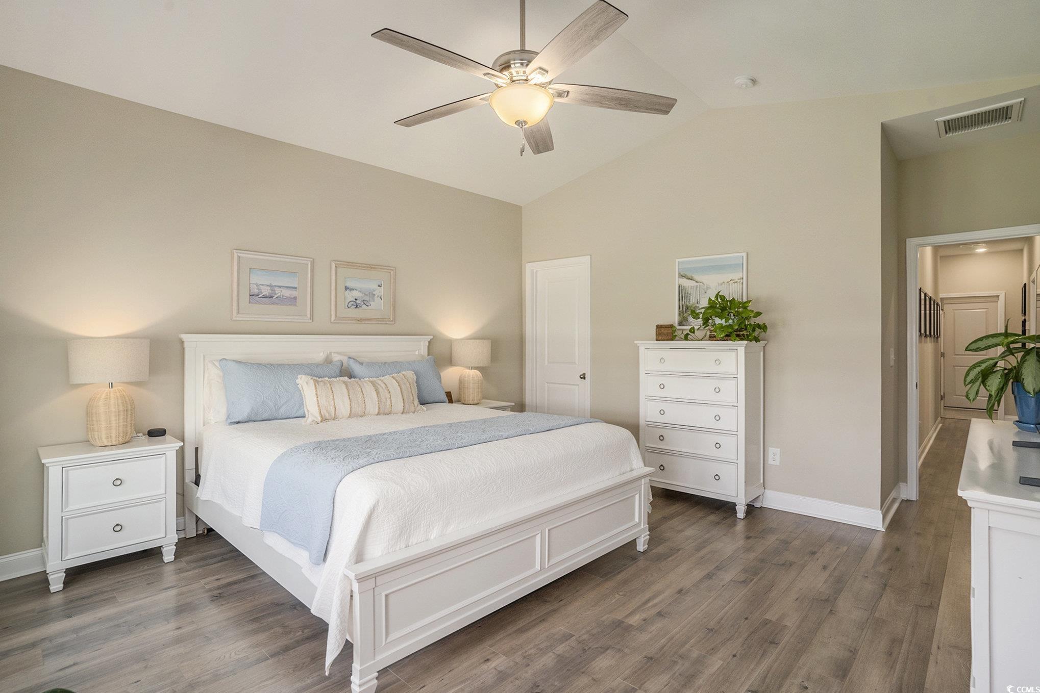860 Brant Street Myrtle Beach, SC 29579 - Photo 21 of 40 Bedroom featuring wood finished floors, high vault