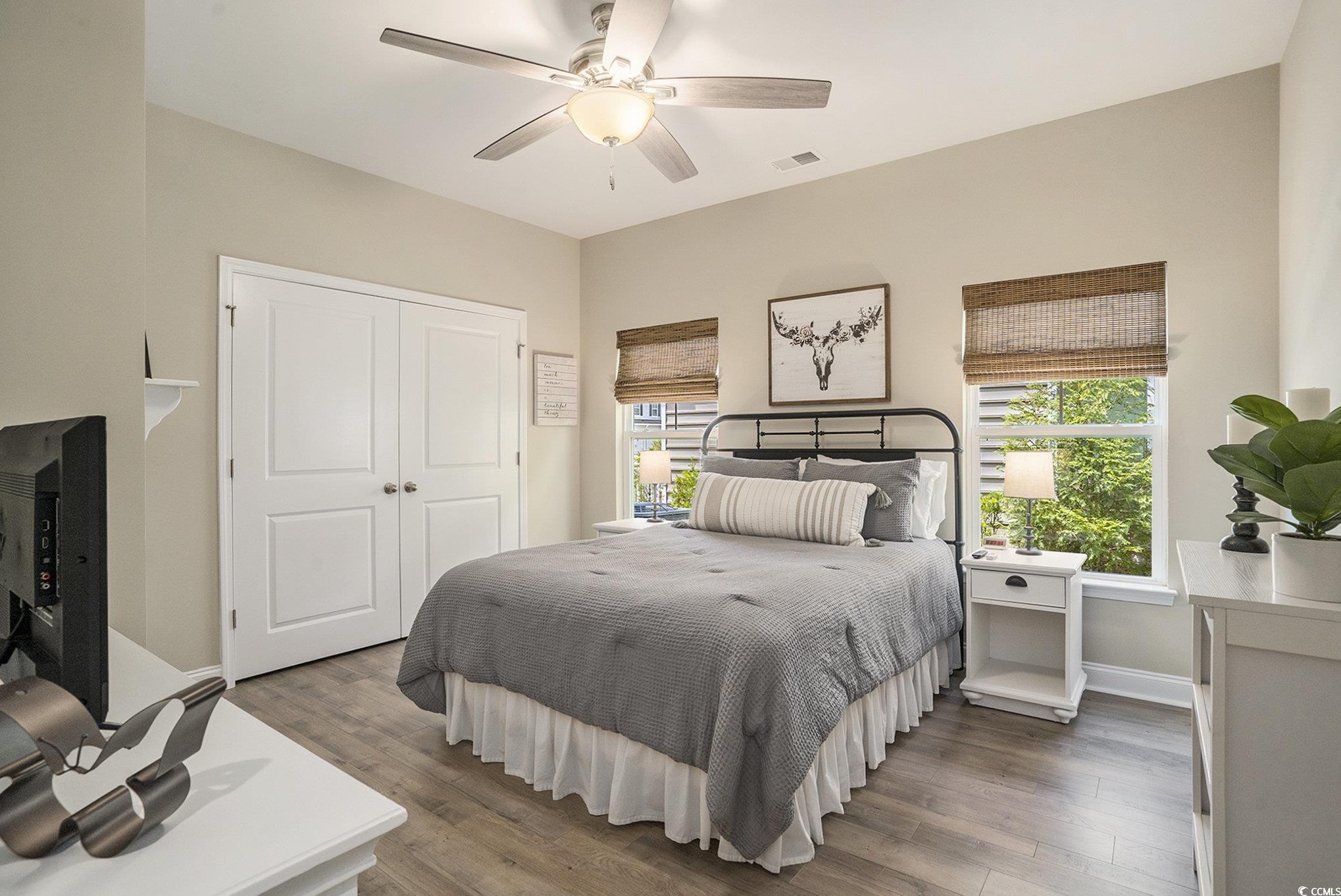 860 Brant Street Myrtle Beach, SC 29579 - Photo 23 of 40 Bedroom with wood finished floors, a closet, and a