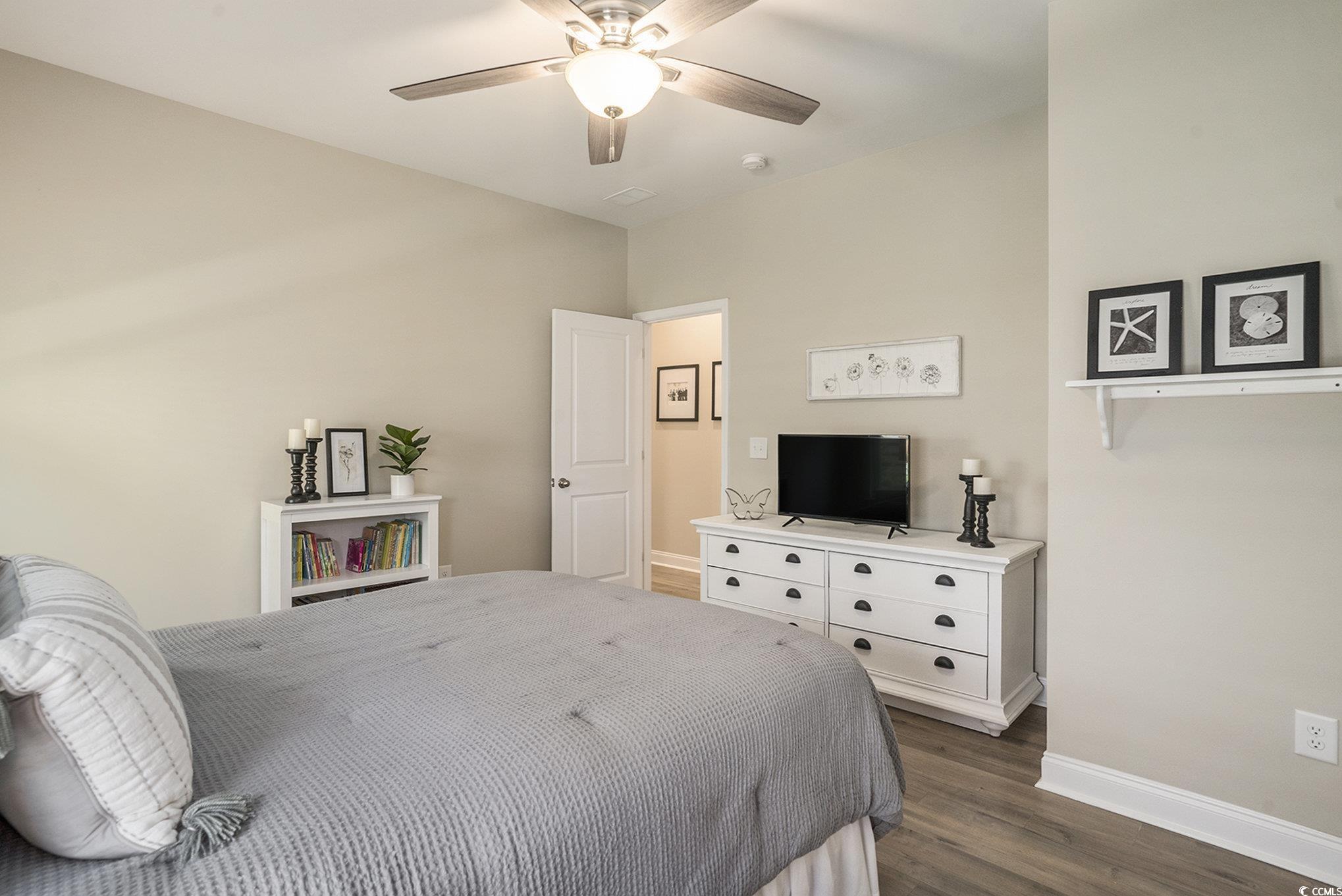 860 Brant Street Myrtle Beach, SC 29579 - Photo 24 of 40 Bedroom featuring dark wood finished floors and a