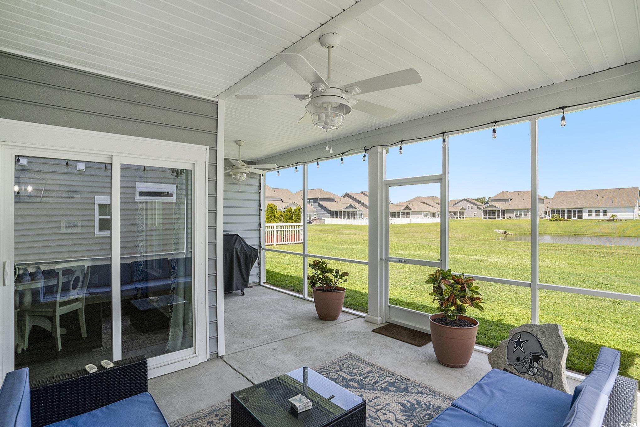 860 Brant Street Myrtle Beach, SC 29579 - Photo 27 of 40 Sunroom with a ceiling fan, a water view, and a re