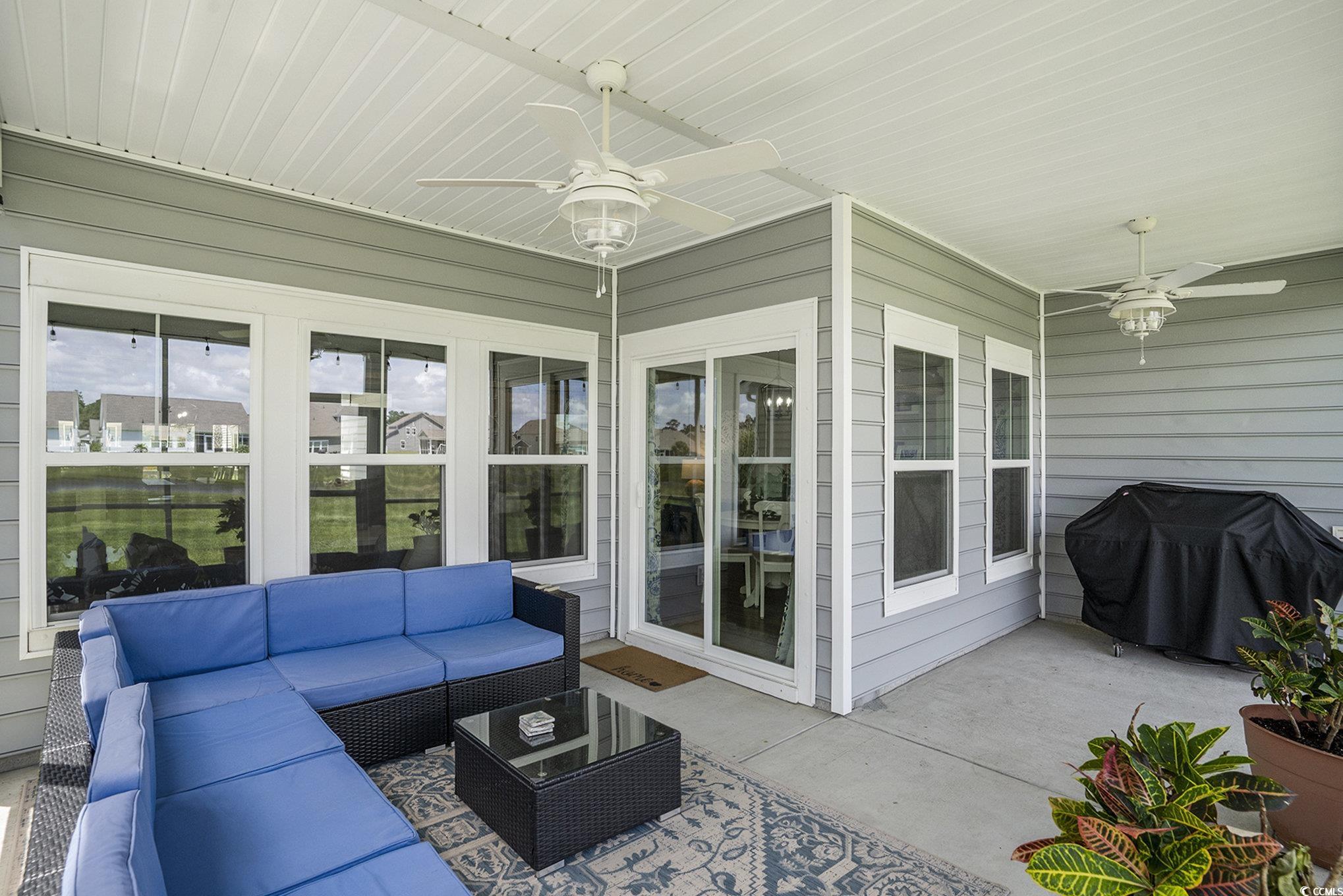 860 Brant Street Myrtle Beach, SC 29579 - Photo 29 of 40 Sunroom featuring ceiling fan and an outdoor hango