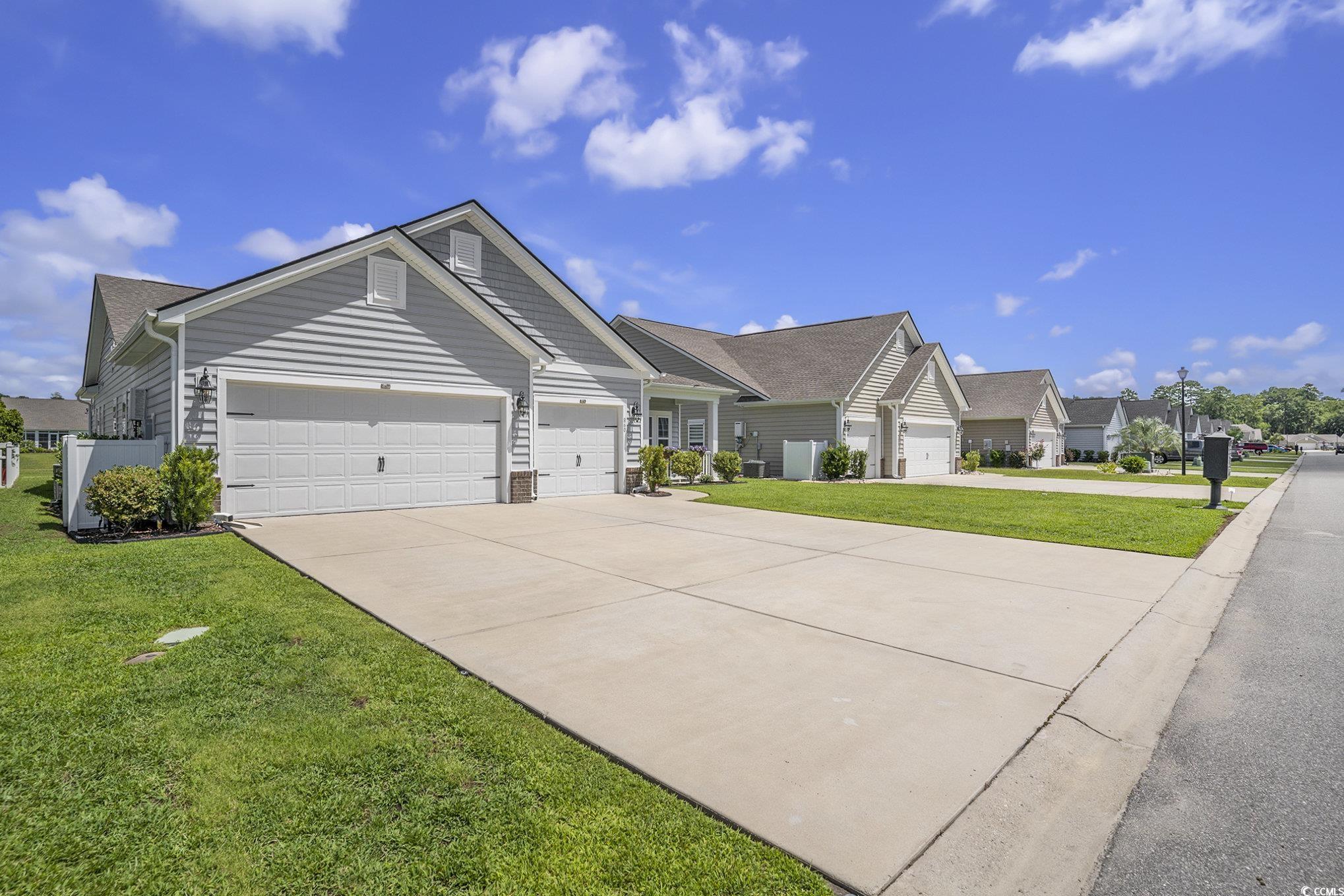 860 Brant Street Myrtle Beach, SC 29579 - Photo 3 of 40 Ranch-style home featuring driveway, an attached g