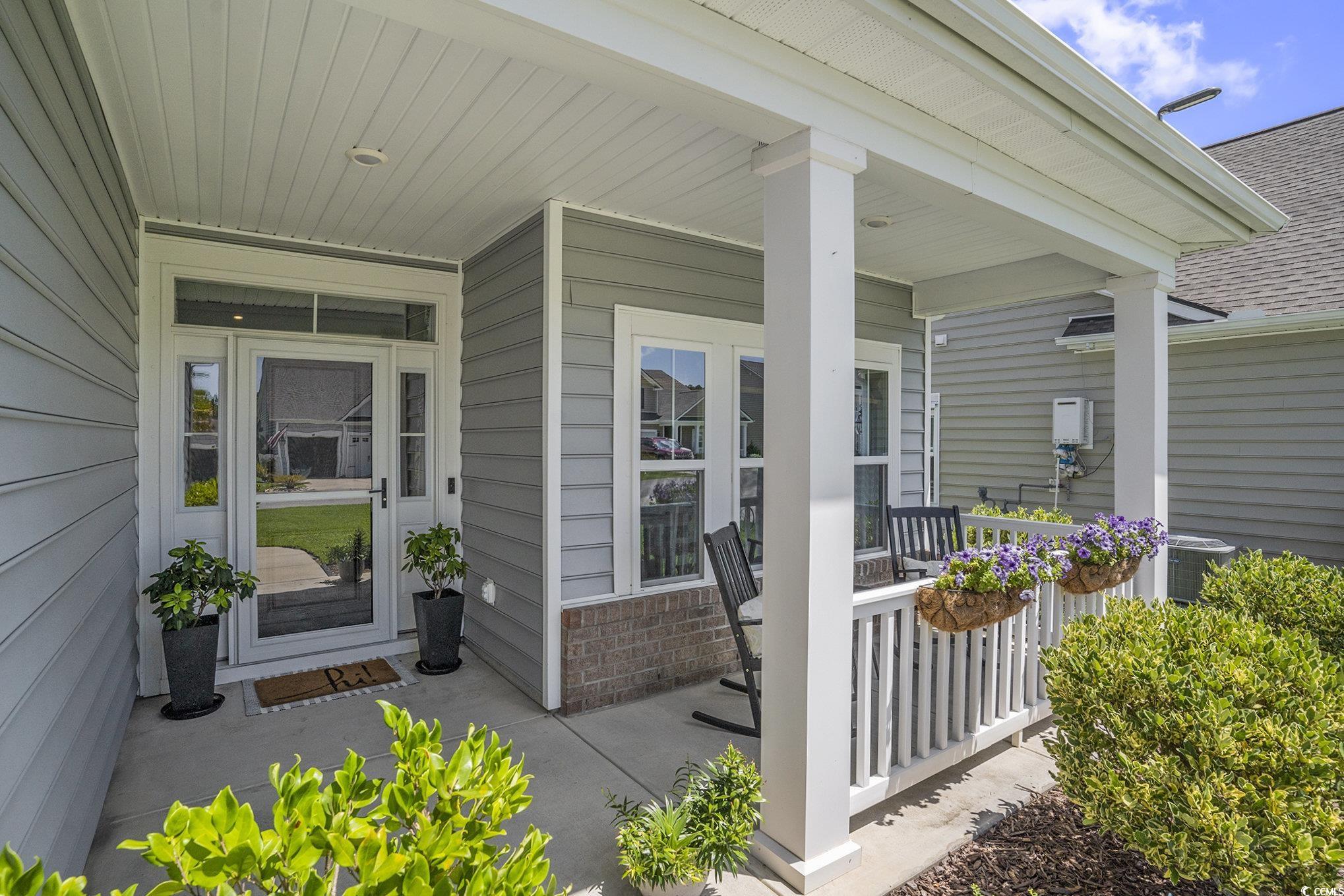 860 Brant Street Myrtle Beach, SC 29579 - Photo 5 of 40 Doorway to property with covered porch and a shing