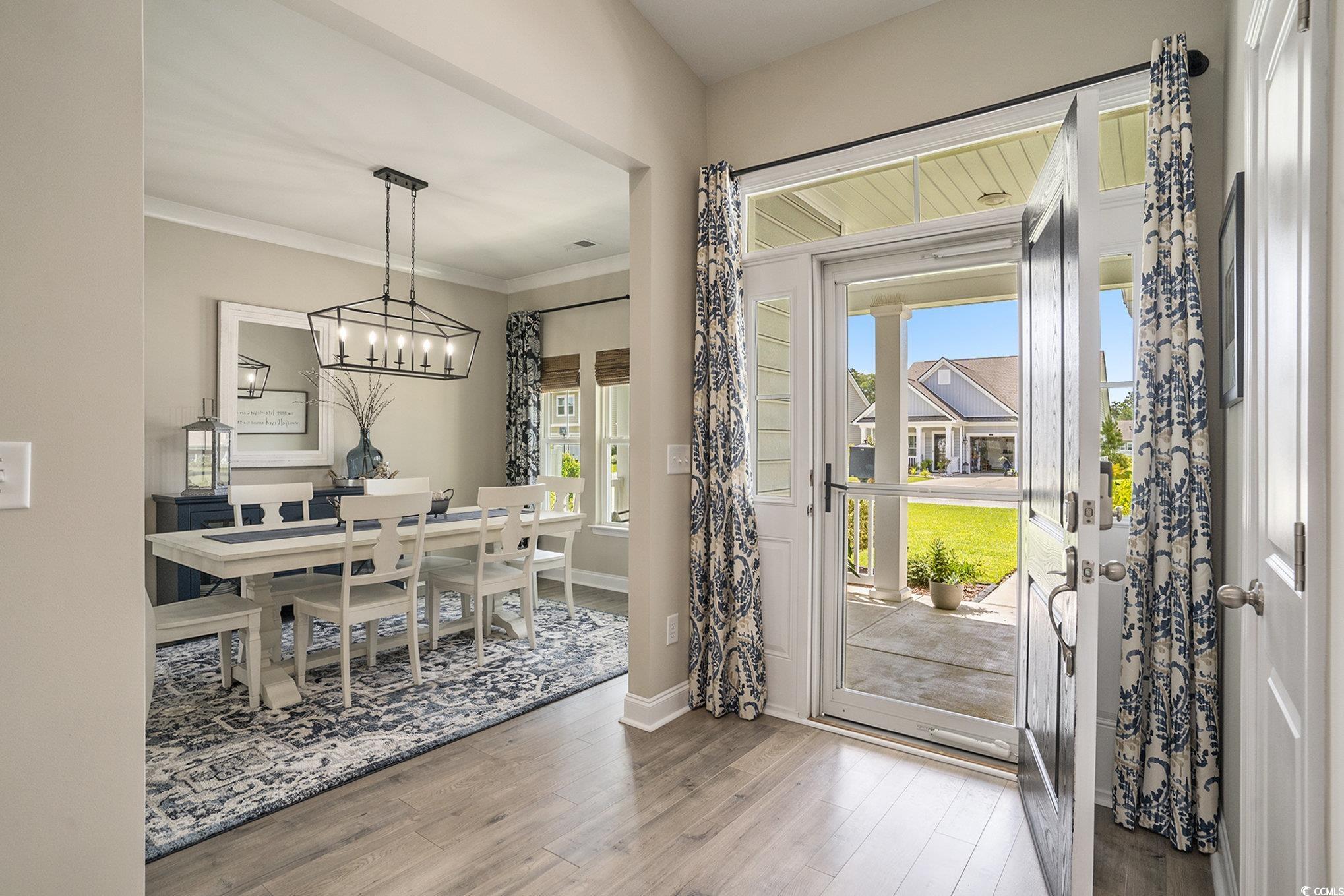 860 Brant Street Myrtle Beach, SC 29579 - Photo 6 of 40 Foyer entrance featuring wood finished floors, a c