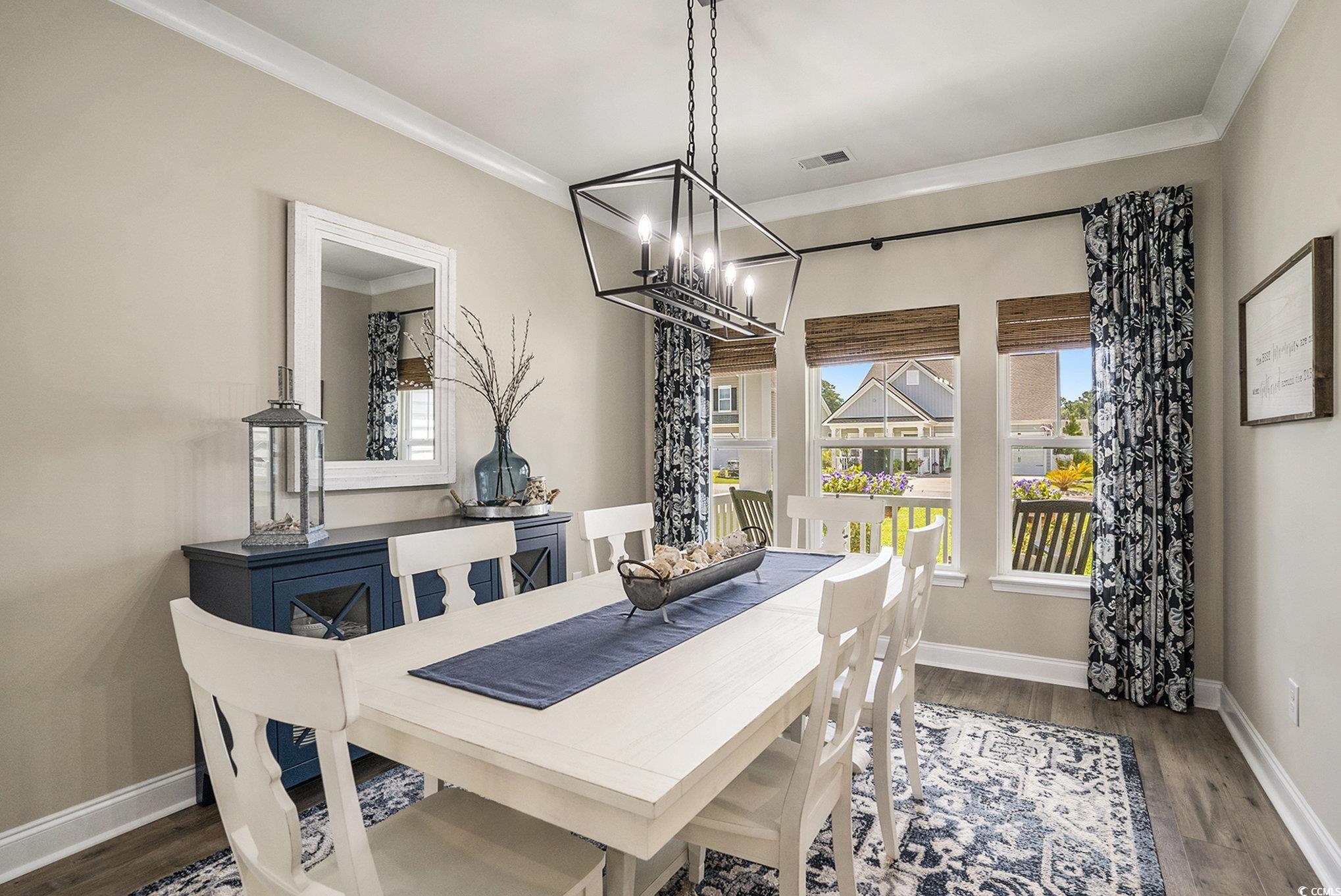 860 Brant Street Myrtle Beach, SC 29579 - Photo 8 of 40 Dining room with a chandelier, wood finished floor