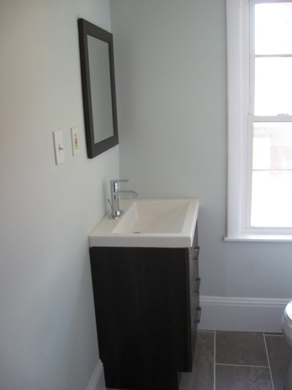 114 Ridge Street Fall River, MA 02721 - Photo 23 of 34 a bathroom with a sink and a mirror