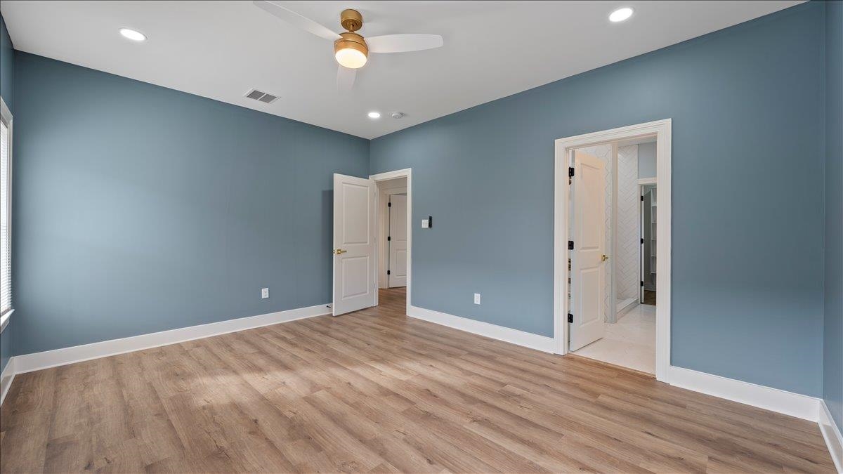 1072 Bruce Street Memphis, TN 38104 - Photo 21 of 27 an empty room with wooden floor and a ceiling fan