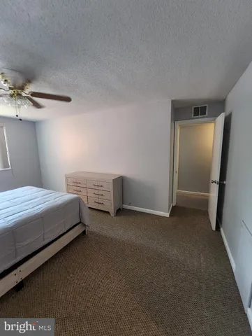 a bedroom with a bed and a cabinets