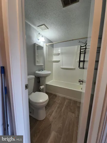 a bathroom with a toilet and a sink