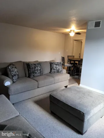 a living room with furniture and a couch