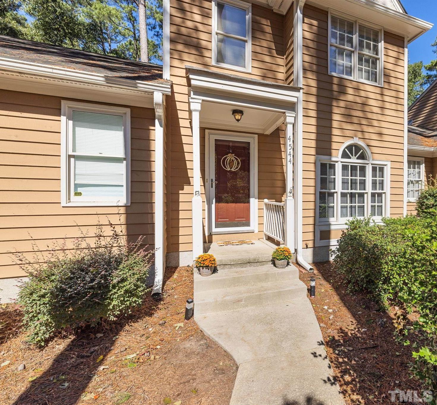 4544 Antique Lane Raleigh, NC 27616 - Photo 1 of 20 a view of a brick house with potted plants