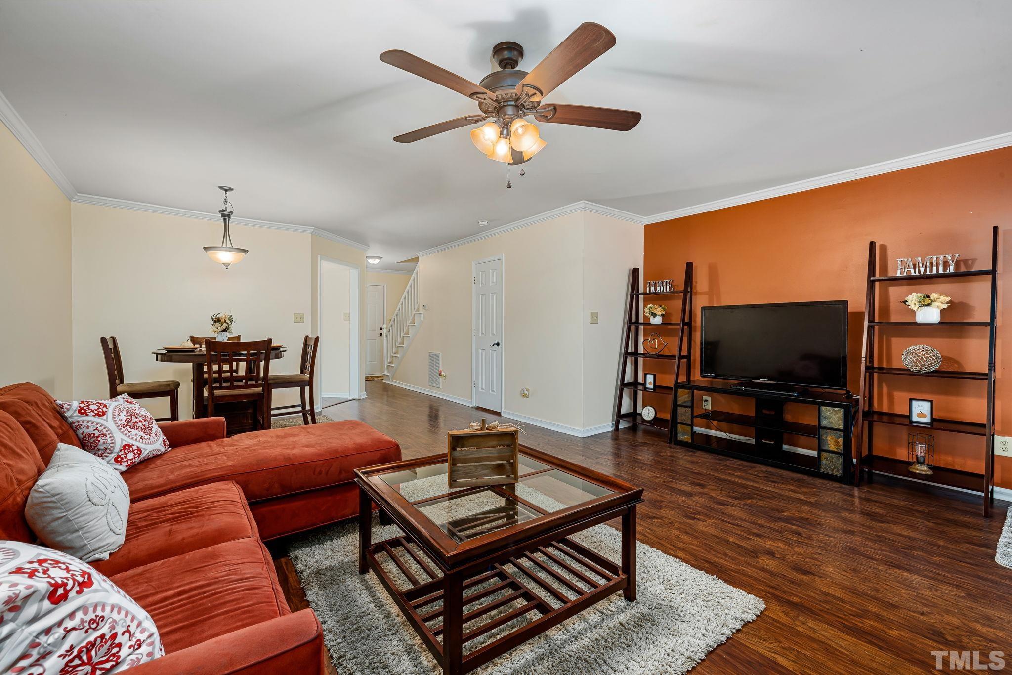 4544 Antique Lane Raleigh, NC 27616 - Photo 3 of 20 a living room with furniture and a flat screen tv