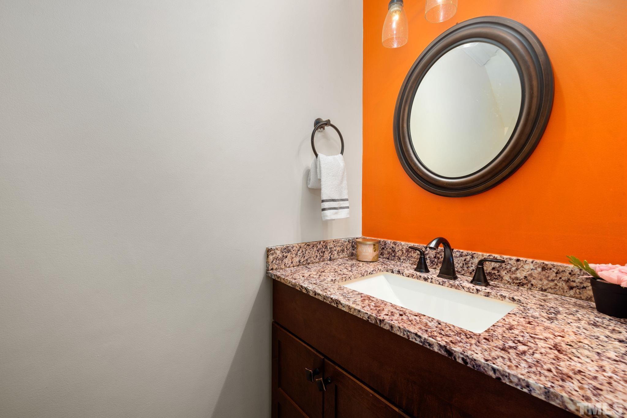 4544 Antique Lane Raleigh, NC 27616 - Photo 7 of 20 a bathroom with a granite countertop sink and a mirror