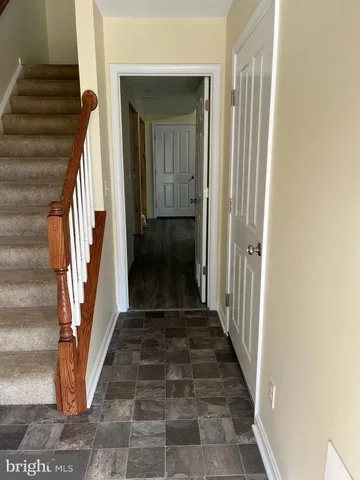 a view of a hallway view with staircase