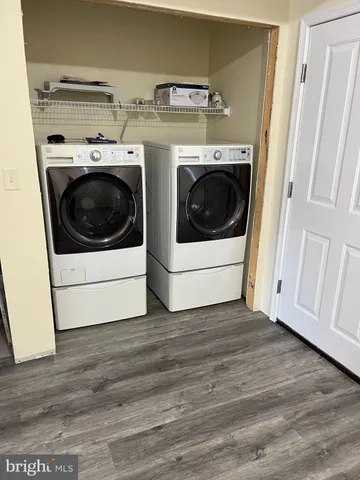 a utility room with washer and dryer
