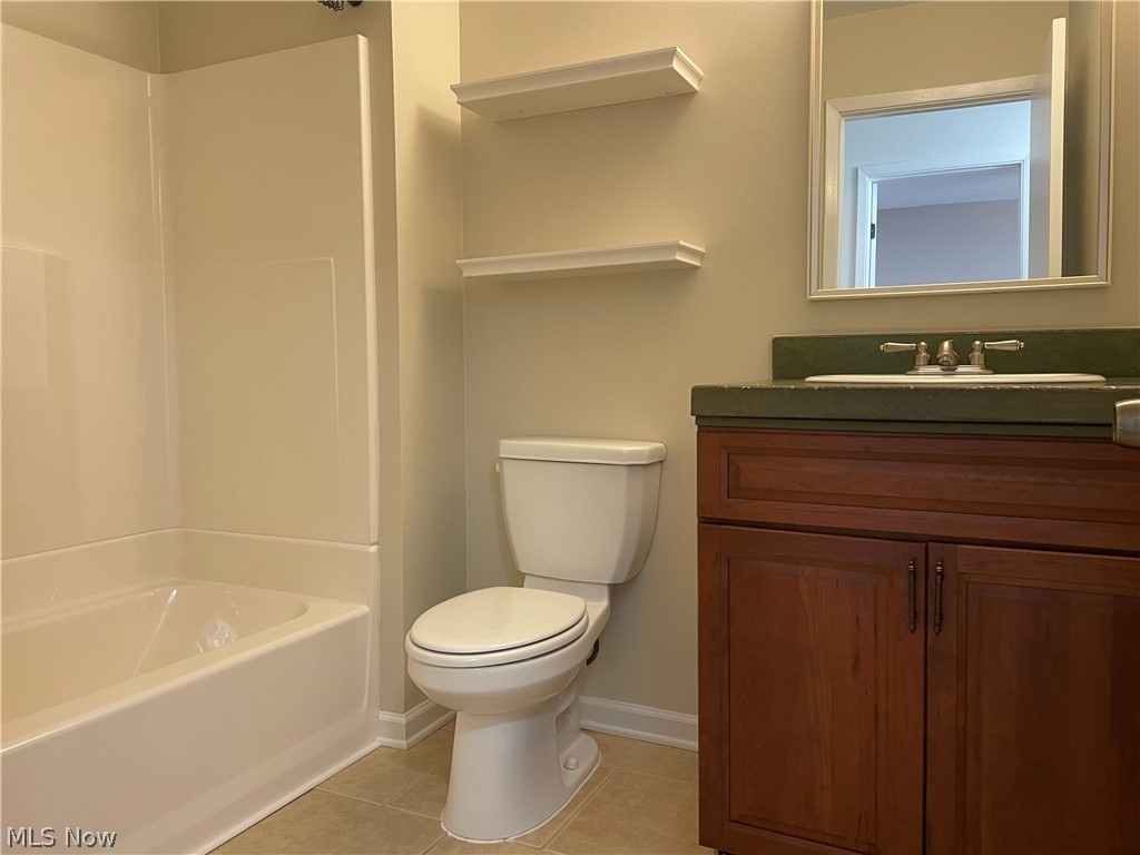 6577 Engle Road, Unit 41D Brook Park, OH 44142 - Photo 16 of 32 Full bathroom featuring tile floors, shower / bathing tub combination, vanity, and toilet