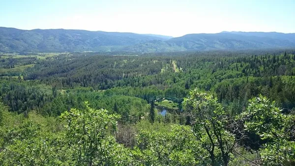 a view of mountains and valleys in the background