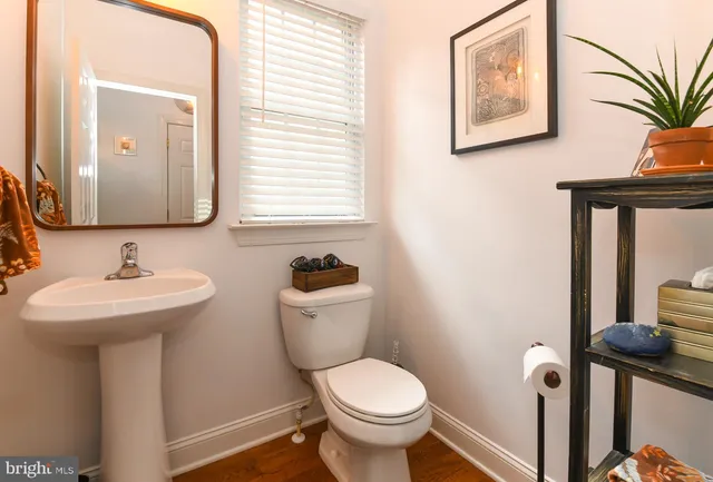 a living room with furniture and stairs