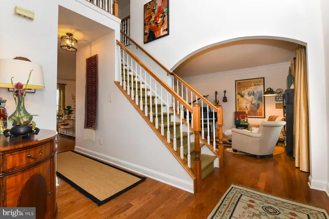 a view of an entryway with wooden floor and windows