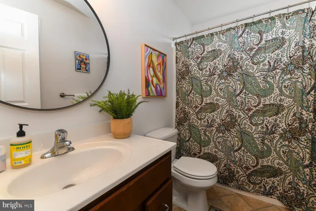 a bedroom with a bed chair and window