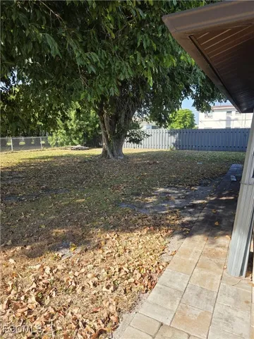 a view of backyard with green space