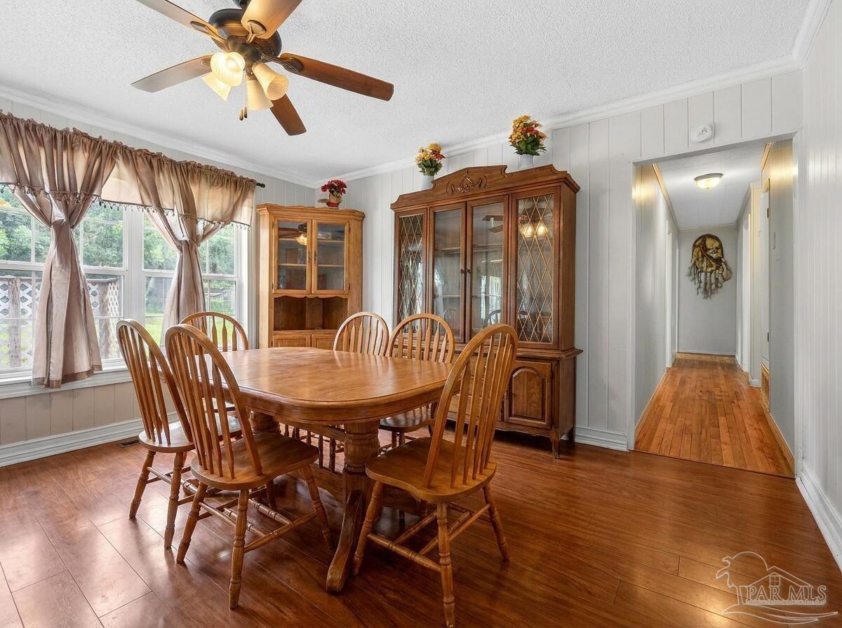 6253 Allentown Road Milton, FL 32570 - Photo 8 of 31 a view of a dining room with furniture window and wooden floor
