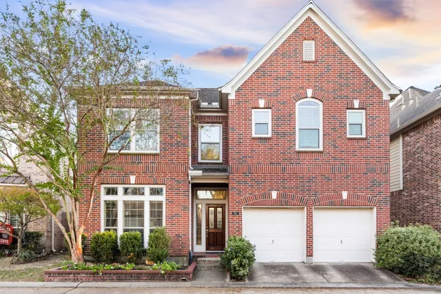 a view of a house with a sign broad