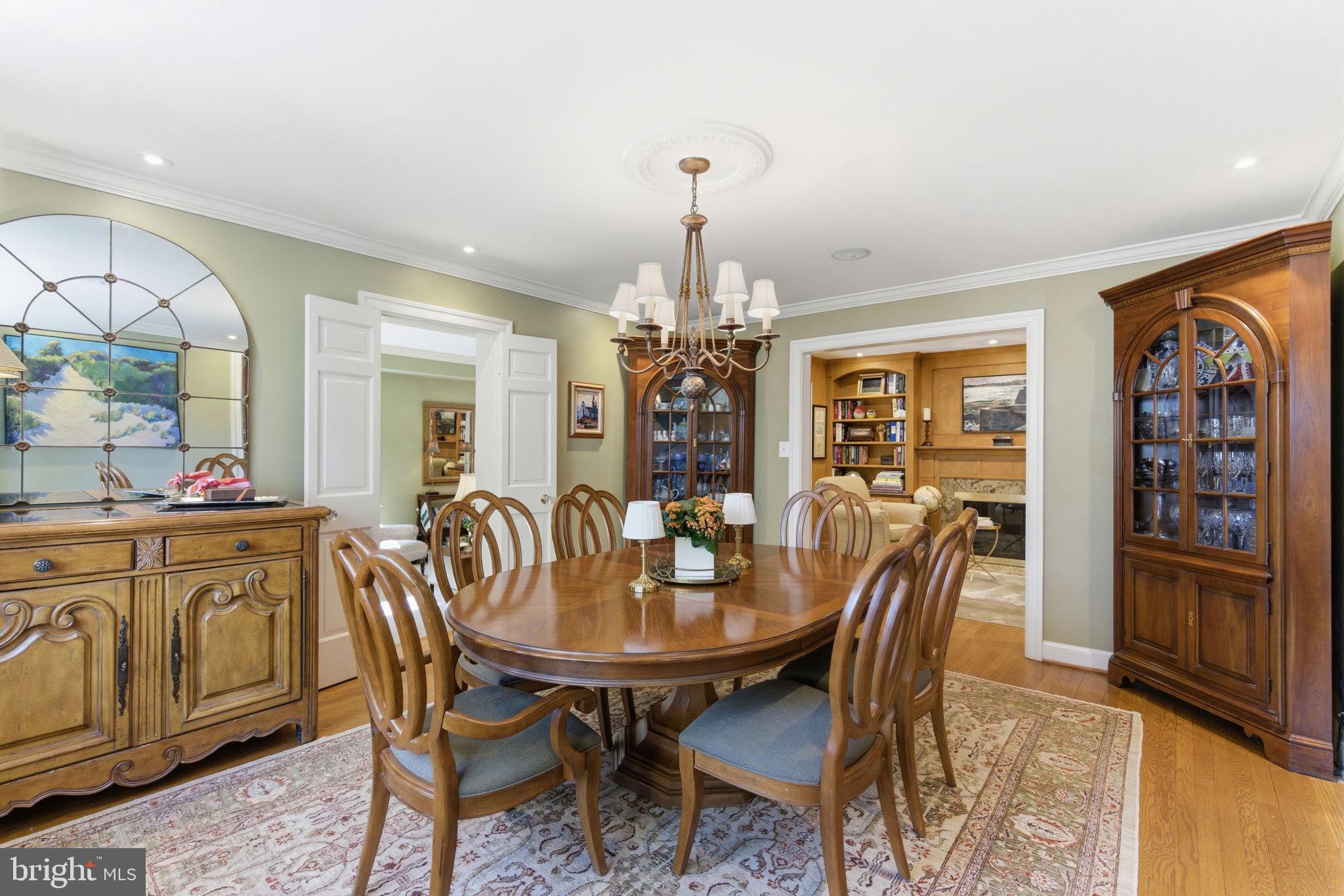 5310 Elliott Road Bethesda, MD 20816 - Photo 24 of 89 a view of a dining room with furniture window and wooden floor