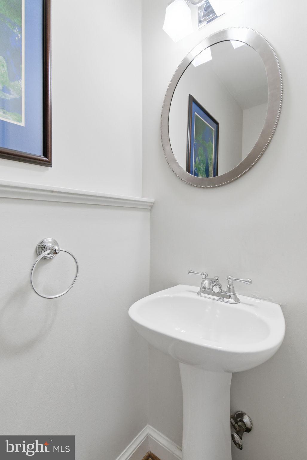 5310 Elliott Road Bethesda, MD 20816 - Photo 39 of 89 a bathroom with a sink and a mirror