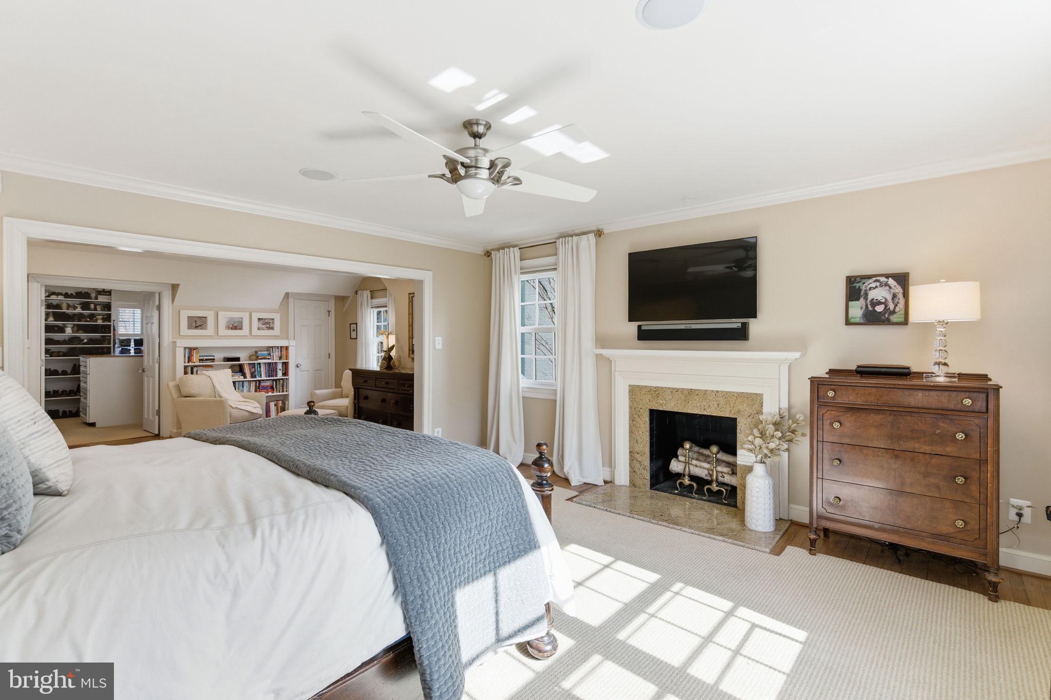 5310 Elliott Road Bethesda, MD 20816 - Photo 46 of 89 a spacious bedroom with a bed and a flat screen tv