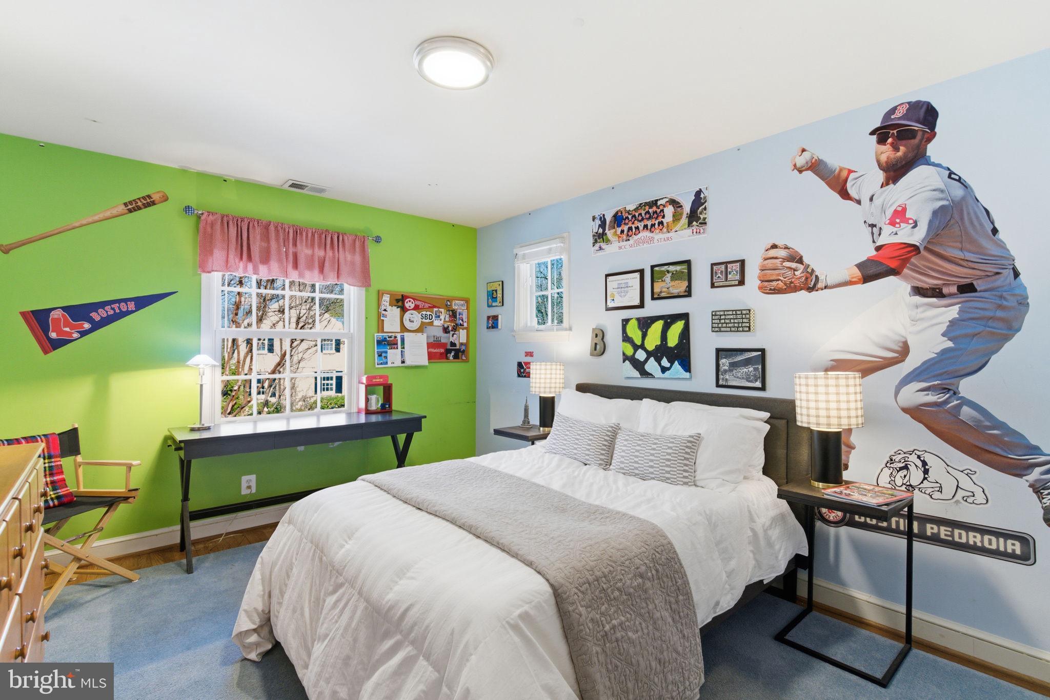 5310 Elliott Road Bethesda, MD 20816 - Photo 71 of 89 a bedroom with a bed a desk and book shelfs