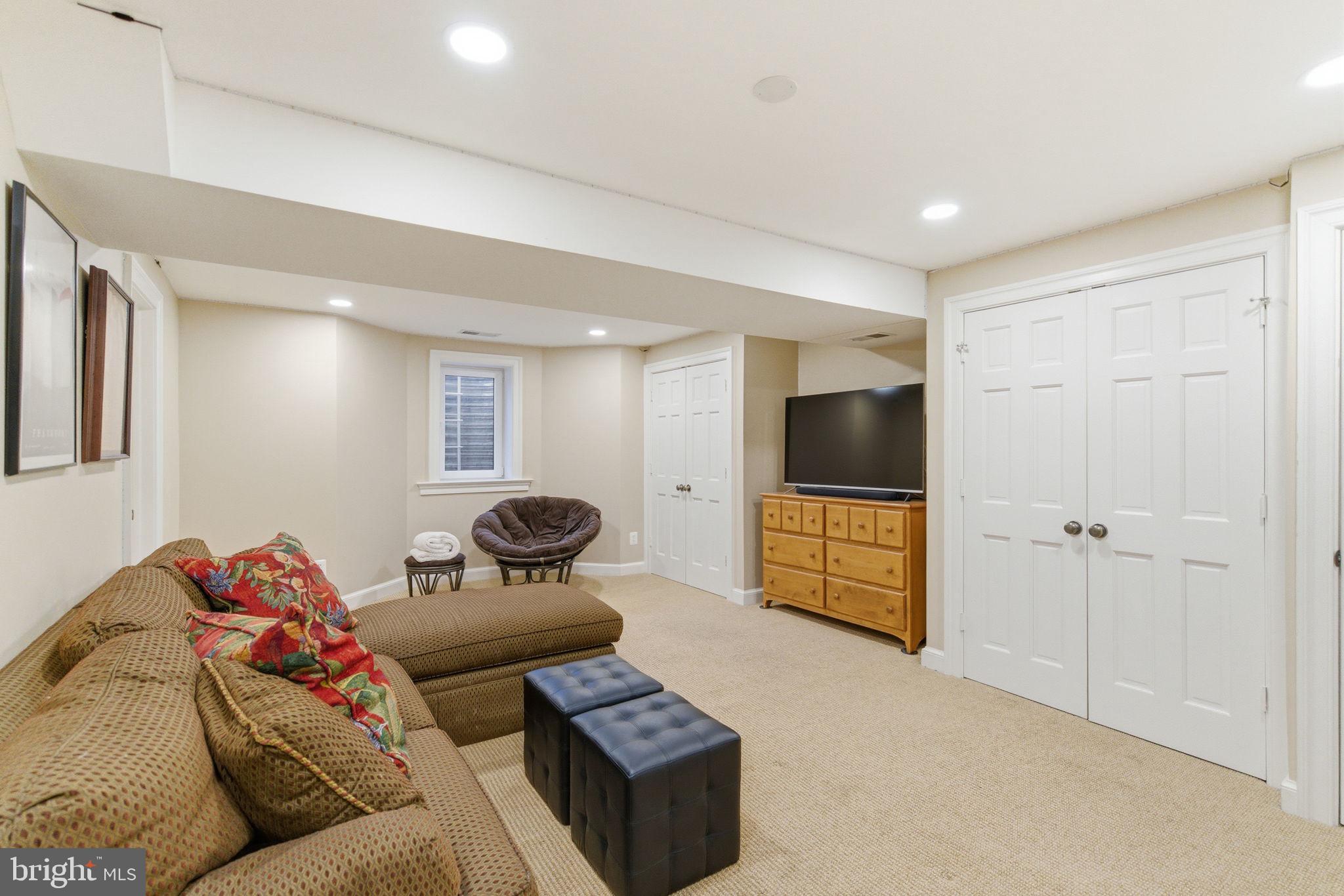 5310 Elliott Road Bethesda, MD 20816 - Photo 74 of 89 a living room with furniture and a flat screen tv