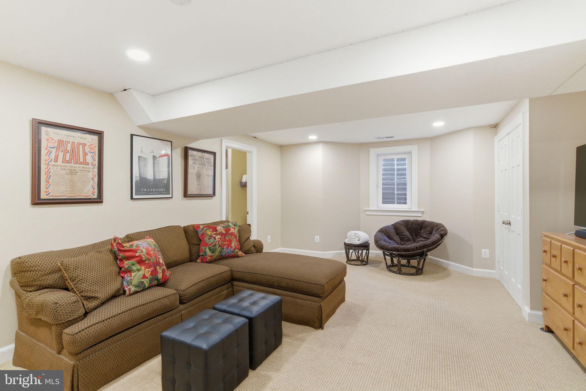 5310 Elliott Road Bethesda, MD 20816 - Photo 75 of 89 a living room with furniture a couch and large window