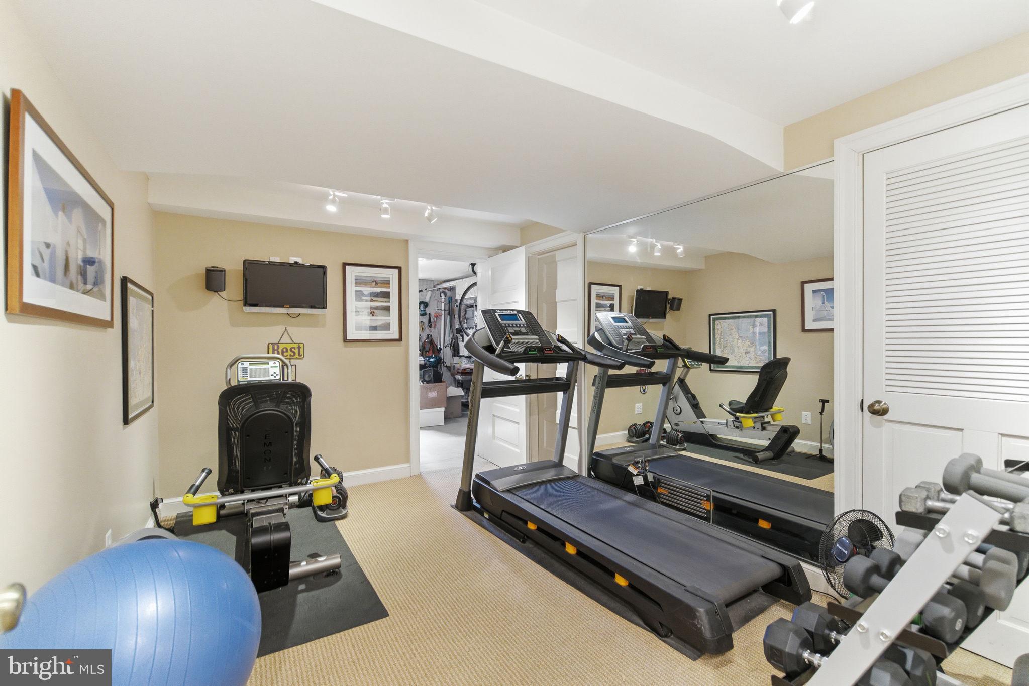 5310 Elliott Road Bethesda, MD 20816 - Photo 80 of 89 a room with gym equipment and windows