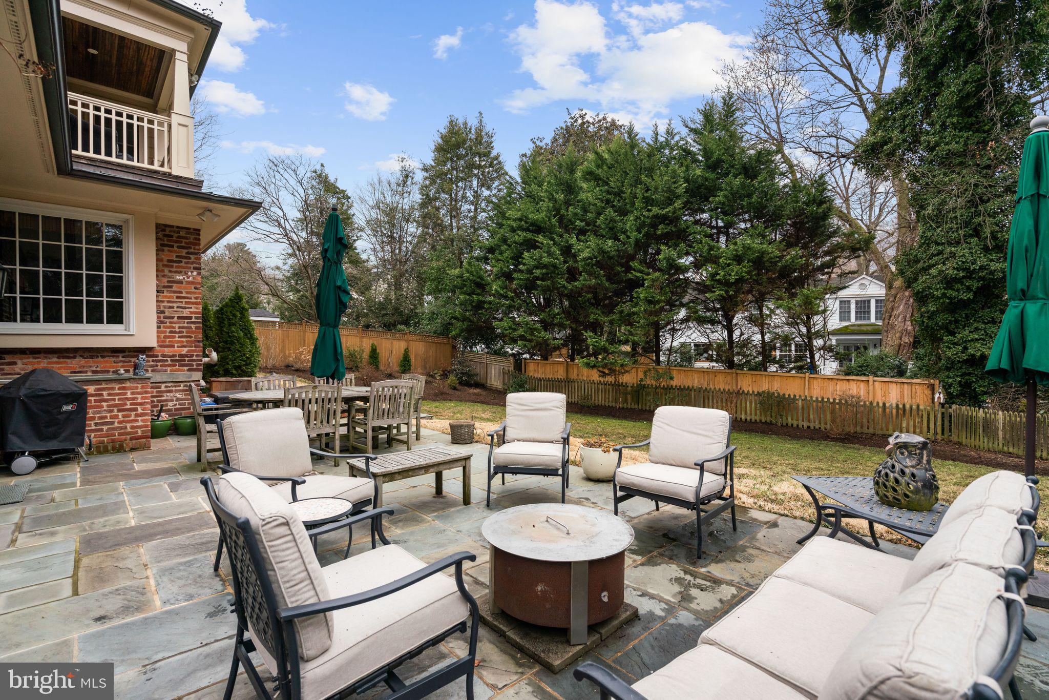 5310 Elliott Road Bethesda, MD 20816 - Photo 83 of 89 a view of a patio with couches table and chairs and potted plants