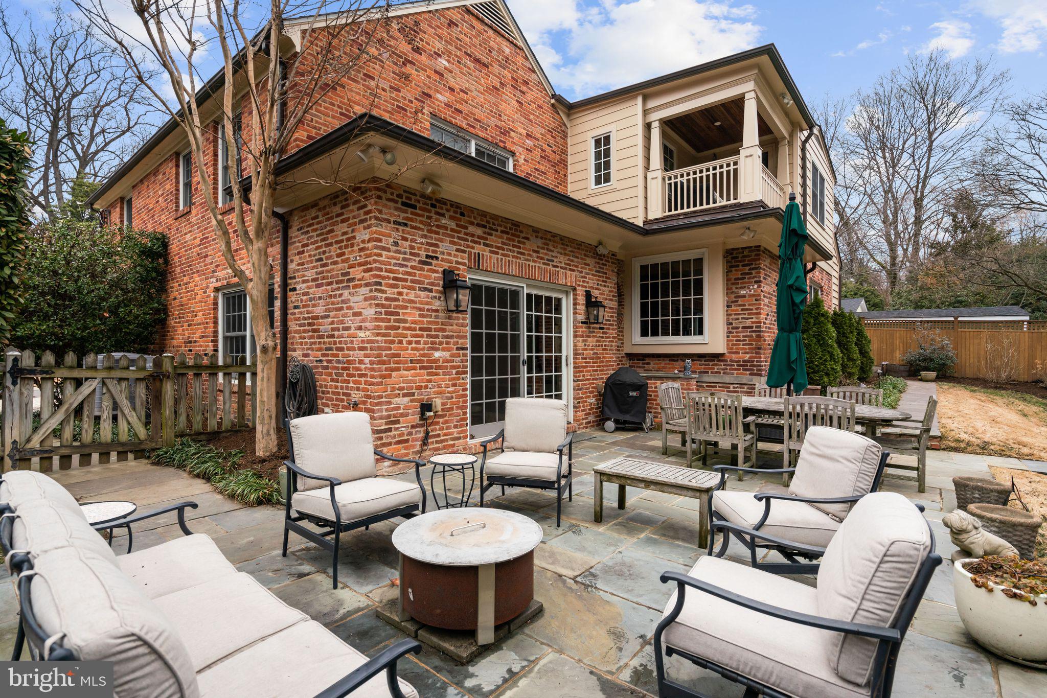 5310 Elliott Road Bethesda, MD 20816 - Photo 84 of 89 a view of a patio with couches table and chairs and potted plants